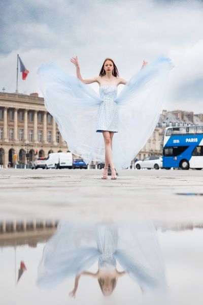 Rochie STRONG BABY scurta, fara maneci, cu decolteu, cu spatele gol, din tul bleu cu broderie din micropaiete si margele argintii model uniform aplicat pe satin elastic bleu